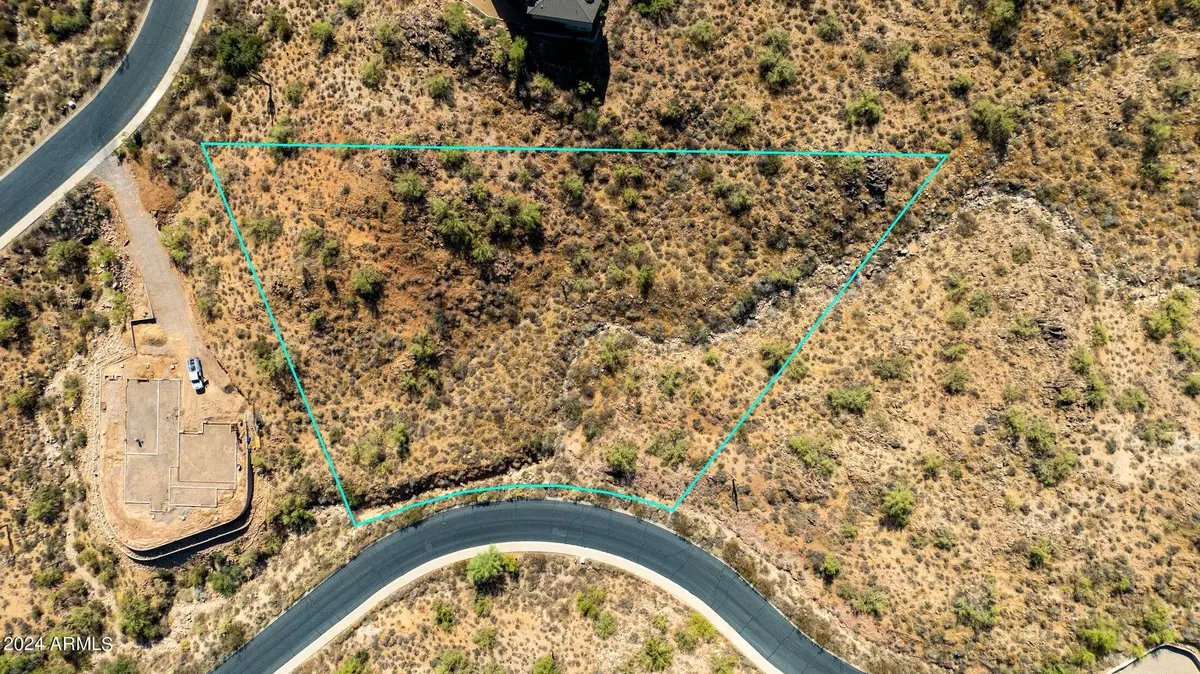 Aerial view with the 1.15-acre parcel boundary outlined, showing its position on the cul-de-sac